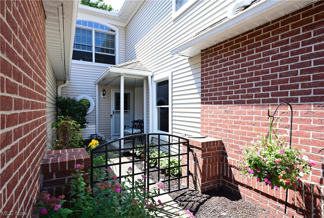 Cool townhouse in Wyndgate II! Extensively remodeled over the last 5 years! Enter through a private courtyard into a two-story foyer that opens into a large great room with vaulted ceiling/two skylights/window wall/plank LTV flooring! Very open kitchen and dining room with gas-log fireplace/wood mantle/lovely custom tile work and built in cabinet/bookcase! Renovated kitchen with white painted cabinetry/granite counters/glass tile backsplash/ceramic plank floor/SS appliances including gas range/double black sink...large eating area off kitchen...could be home office! Newer lighting! Great half bath with newer white fixtures and white wood vanity! Double landing staircase to upper loft area open to great room! Master bedroom with vaulted ceiling/half round windows/LTV flooring/walk-up and walk-in closet! High ceilings! Spacious master bath with soaking tub/4-foot shower/double sink with vanity/round modern mirrors and accent wallpaper! Fresh interior paint! Beautiful main bath (black/whi