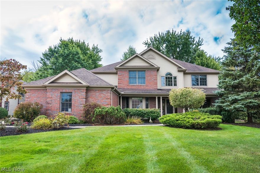 Updated and stately best describes this great front porch colonial. The two story foyer with hardwood flooring leads to the spacious office with custom built-ins and the formal dining room. This is a true 5 bedroom home with a bedroom and full bath on first and the other 4 bedrooms on the second. The large family room is a relaxing space for the family with a wall of windows, custom beamed ceiling accent and a nicely updated stone front fireplace with custom Amish mantle. The kitchen is the real heart of the home with hardwood floor, a center island, walk in pantry, wonderful eating area, and much counter and cabinet space. The oversized eating area has ample space and offers a sliding door to the deck and backyard. The back hall has custom cubbies and the laundry offers excellent space with much storage! The master suite has it all, from the larger bedroom with large tray ceiling to the oversized closets to the recently remodeled bath with custom shower, freestanding tub and double va