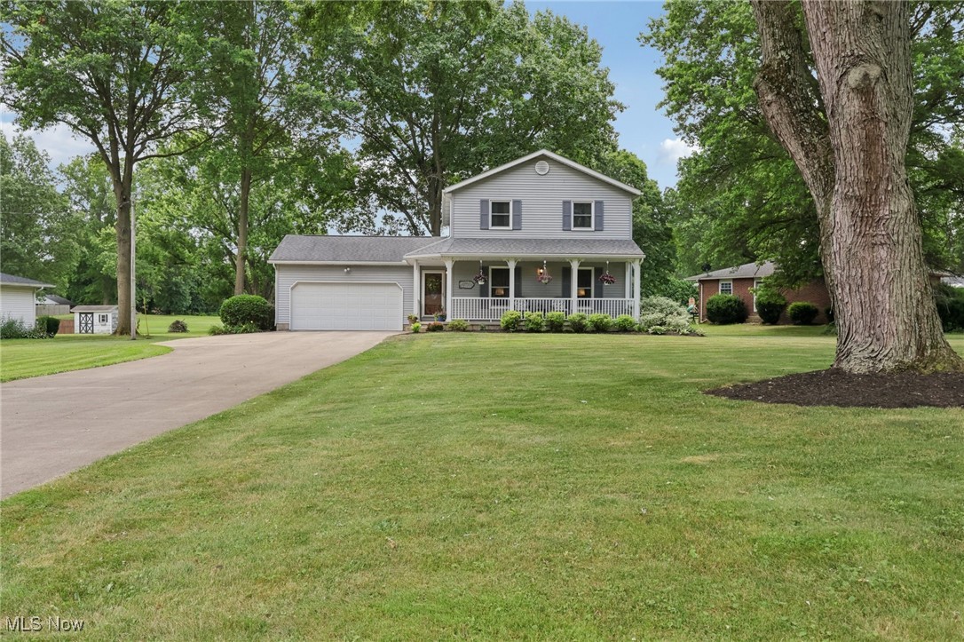 Welcome to this well-loved home, proudly maintained by its original owners, nestled in an established neighborhood with mature trees. This 3-bedroom, 2.5-bath Colonial features an inviting front porch, attached 2-car garage, and additional shed. The main level showcases new flooring (2022) and a functional layout with a kitchen that includes a breakfast bar, eating area, pantry, granite half bath, and convenient first-floor laundry. The spacious primary suite offers his-and-her closets, new carpet (2024), and a beautifully updated ensuite bath with a double vanity, Granite countertops, and a tiled shower. A bright and airy 15x22 three-season room provides the perfect space for relaxing or entertaining. The partially finished basement offers potential for a fourth bedroom or home office. Additional updates include a new well pump (2024) and roof (2015). One-year home warranty included.