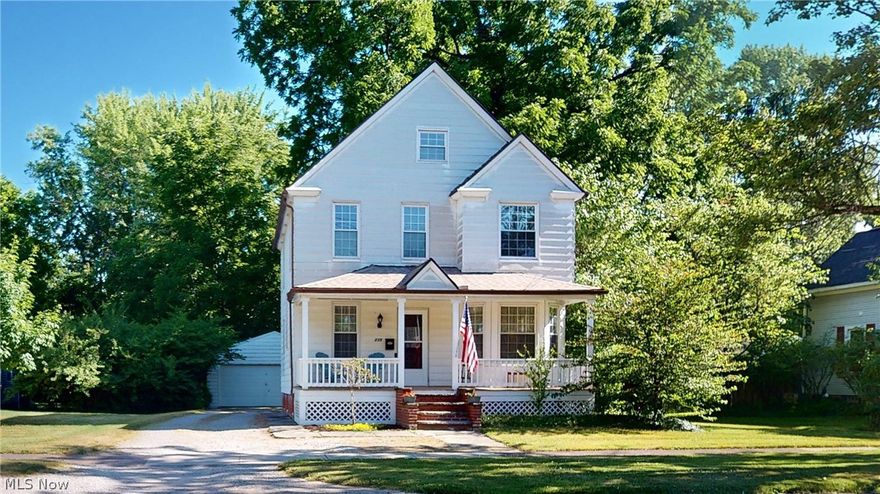 Beautiful Century home full of character, lots of detail, woodwork, custom blinds, ten-inch baseboards, and nine-foot ceilings on the first floor. The full front porch for a swing is a great spot to enjoy the Fourth of July parade that goes right past this home. Upon entering, the parlor is ready for game nights and with a handsome staircase to the second floor. The living room has a decorative fireplace and a comfy atmosphere.  Elegant dining room with large crown moulding and beautiful Patagonian Rose hardwood floor. The kitchen has a movable island that can be tucked away making for a great area for entertaining. The second floor has more charm as you enter the primary suite, updated full bathroom, oversized tub, custom tile surround with detailed niches. The hall bathroom has a second oversized tub and pocket door divider. There are two more wonderful bedrooms on this floor both with lots of natural light. Wander up to the third floor with custom built-in wall-to-wall shelves to hang out, tv or a great book. Five large cubbies for all your storage. The cozy back porch leads to a deep backyard shaded by a huge black walnut tree and view of nature. Lots of open space. Berea sandstone patio leads to the hidden sandstone patio set under an island of trees, large fire pit. This home is situated between the Cuyahoga County Fairgrounds and a short walk to Coe Lake, the the Berea outdoor pool, library, and playground with a brand new tree house. Downtown Berea dining, coffee shops, and grocery store!