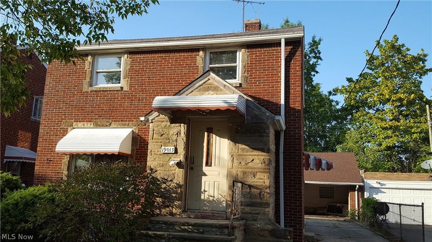 Sweet! A nice brick colonial home - just waiting for you and your finishing touches! Enjoy lazy evenings by the fireplace in the spacious living room... and adjoining the dining room with built-in corner cabinets, perfect space for special occasions...  The eat-in kitchen has a cozy space for coffee or quick meals, and overlooks the pretty back yard. On the second floor - three bedrooms, and a full "retro" bathroom. The basement has a huge rec room - turn it into space for movie nights, working out, hobbies - whatever you choose - and there is a full bath with a walk-in shower as well! The two car garage is a great feature - it will fit your vehicles and ALL of your toys.  And, what a terrific location - around the corner from all of the independent eateries on E. 185th Street, and close to Waterloo Arts District, Metroparks, Lake Erie, transportation, freeways, medical and shopping! Don't wait - see it today!