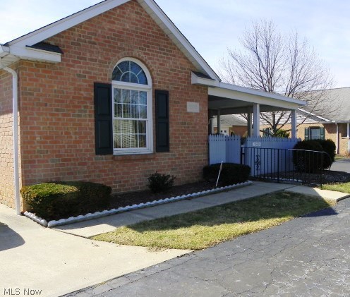 Carefree living at its best in this ranch style condo centrally located in Hartville Country Commons, a 55+ community* Open floor plan with a vaulted great room which opens to dining room & eat in kitchen* Oak kitchen with corner china cabinet, desk, roll out shelves & skylight* Appliances include- electric range, dishwasher & newer refrigerator with water dispenser* Master bedroom with walk in closet, fan & private access to bath with tub & separate shower* Spacious laundry, 1/2 bath with cupboards & includes washer & dryer* 1.5 car attached garage with storage closet, overhead storage with pull down stairs, water & opener* Private setting with 16x14 covered partially enclosed patio* Condo fee $200/mo. * Gas budget approx. $65.00* Home warranty provided* Immediate possession* Excellent value!