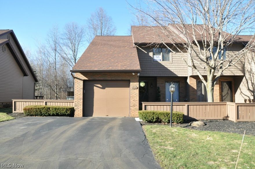 Beautifully upgraded 2 bedroom condo w/new cherry hardwood flooring in great room, new carpet throughout, new 35 year shingle roof, new vinyl siding, new drop ceiling in rec room, Jacuzzi tub & separate shower in main bath that adjoins master bedroom. New 15 x 26 tiered deck, new stamped concrete patio overlooking park-like back yard w/creek & wooded view. Breakfast bar in kitchen. New furnace & air 2013. This immaculate condo is perfect!