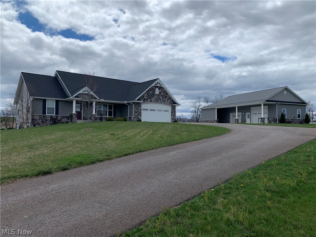 AUCTION. In a prime location between Berlin and Fryburg. This beautiful well-built home was constructed in 2021 and offers 1,482 square ft. of living area, on 3.84 acres. Entering through the 2-car attached garage will be a mudroom/laundry room. The main floor has a custom Schrock’s kitchen with Corian countertops. The kitchen has an island, a dining area, and a walk-in pantry
On the outside there is a 44’x24’ shop/barn. The 22’x24’ barn area includes 1 box stall plus storage. The 22’x24’ shop area is heated with a natural gas wall heater and an overhead garage door.
From the immaculate home and barn, pasture area, to the blacktop and concrete driveway you will love everything about this property
