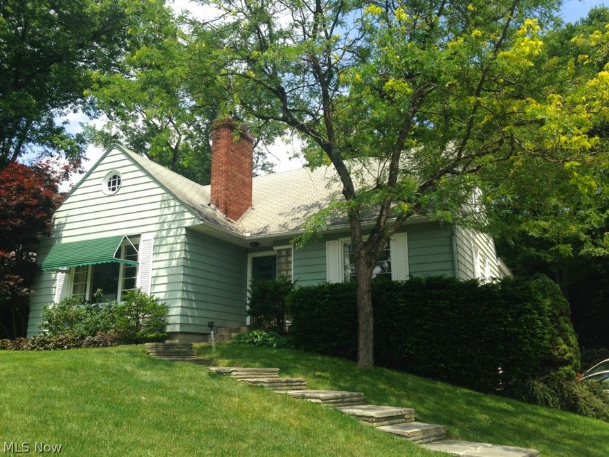 Welcome to 2367 Falmouth, a charming 3 bedroom 2.5 bath cape across from the 8th hole of Fairlawn Country Club golf course.  Walk up the cascading stone steps and turn around for a breathtaking view of the lush green.  Built in 1951, this one-owner 2,444 sqft home was lovingly cared for and ready for its next owners touch.  Large fireplaced living room's picture window highlights sweeping, verdant view.  Dining room with sliders to back patio.  Cozy hearth room off of kitchen features brick wood-burning  fireplace, access to stone back patio and large windows for plenty of light.  1st floor master suite with en suite bath and large private sitting area.  2 cozy bedrooms and 1 full bath upstairs along with large bonus area with tented ceiling - would make a wonderful playroom or craft room.  Basement rec room freshly painted and brand new carpet installed.  2 car attached garage.  Sellers providing 2-10 Home Warranty for peace of mind.  Rare opportunity, don't miss this home and all its