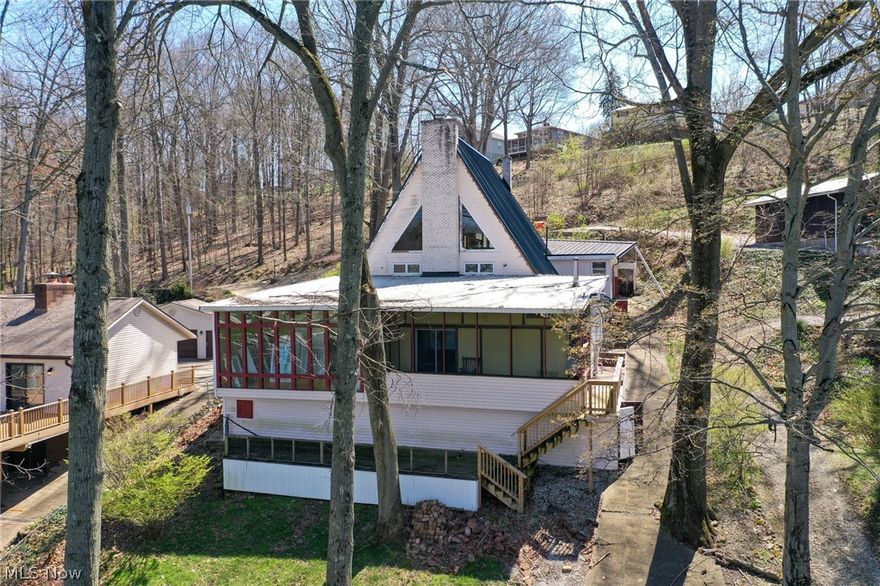 Lakefront A-Frame Home at Lake Mohawk. Brown Local School District, Brown Township, Caroll County. Live Onsite with Online Bidding. Absolute auction, all sells to the highest bidder. ONLINE BIDDING BEGINS FRIDAY, MAY 29, 2026, AT 9:00 AM, AND AUCTION LIVE ON-SITE BIDDING WILL BEGIN SATURDAY, MAY 30, 2026, AT 11:00 AM. Lakefront a-frame home situated in the private Lake Mohawk community. Prime waterfront setting with direct lake access. Home has an updated steel roof and features 3 bedrooms and 2 full updated baths. Originally built in 1972 with remodels in 2009. Open main living area with vaulted ceilings and large windows providing strong lake views. Walk-out on the lower level with additional living space. Multiple decks overlooking the water. Situated on a half-acre lot with a private setting. Opportunity to update and make it your own! Carroll County parcel no. 03-0002433.000. Private, gated Lake Mohawk features a 500+ acre spring-fed lake spanning approx 1,700+ acres. Community offers three beaches, tennis, pickleball & volleyball courts, along with numerous clubs and activities, including boating, skiing, golf, and social events. Well-established setting with year-round recreation for property owners. Ideal for year-round living, weekend retreat, or investment. The home will be open on auction day, starting at 10:00 AM.