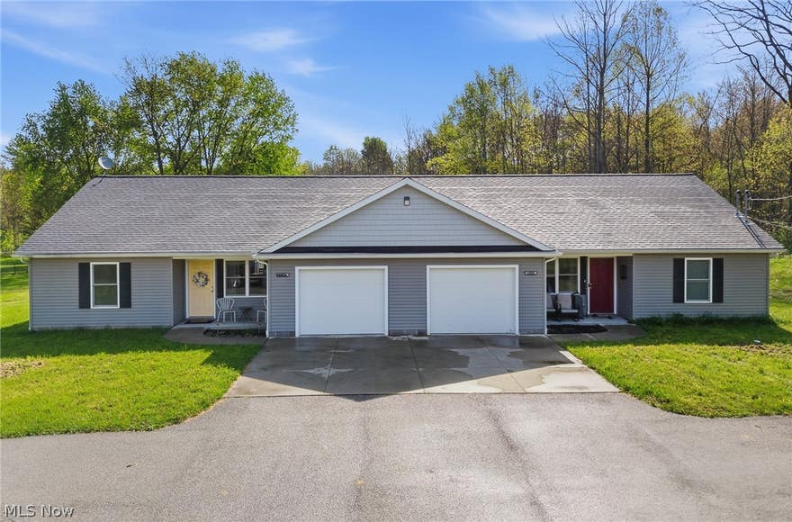 What an incredible opportunity to own this immaculately maintained investment property located in the heart of Mantua! Built less than 10 years ago, this turn-key side-by-side ranch duplex is ready for its next owner to start generating income immediately. Each unit offers everything today’s tenants are looking for. Enter through the private front porch into a spacious, open-concept living room that flows seamlessly into the dining area and oversized kitchen. The kitchens feature ample cabinet and countertop space, along with a man door leading to a private backyard retreat. Situated on over 2 acres of peaceful land, this property offers the perfect blend of privacy and convenience. Both units include in-suite laundry rooms, oversized one-car garages with openers, two generously sized bedrooms, and a full bath. Whether you’re searching for a profitable, low-maintenance investment property or looking to owner-occupy while the second unit helps pay your mortgage, this property checks all the boxes. Don’t miss your chance to own this rare opportunity in Mantua — schedule your private showing today before this one is SOLD!