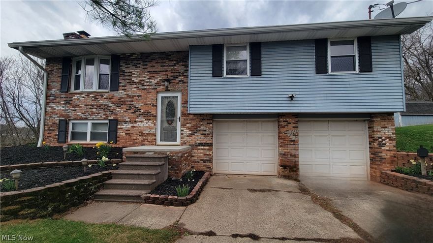 Charming Split Foyer Home on Nearly an Acre.
Take a stroll through this inviting split foyer home featuring 3 bedrooms and 2.5 bathrooms, perfectly situated on a spacious 0.9-acre lot just minutes from city limits. The updated kitchen showcases beautiful oak cabinets, a convenient breakfast bar, and a bright window ideal for growing fresh herbs. The adjoining dining room includes a sliding door that opens to a covered deck overlooking the serene backyard and wooded views—perfect for relaxing or entertaining. The central vacuum system makes chores a breeze. Downstairs, the cozy family room features a brick-faced wood-burning fireplace, creating a warm and welcoming atmosphere. This home combines comfort, style, and convenience in a peaceful setting. Don’t miss the opportunity to make it yours.
