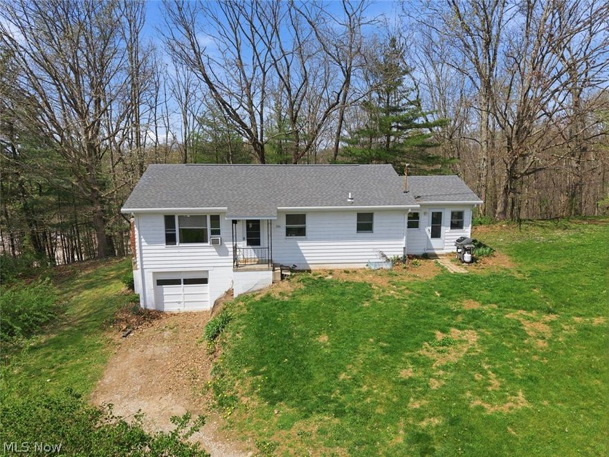 Affordable country home on 1.99 acres with room to build out a small homestead. The acreage offers usable ground, scenic views, and space for a garden, small livestock, or hobby farming. Access is via a shared Easement.

The home features 3 bedrooms, 1.5 baths, with 1,040 square feet of living space, wood floors, and a functional layout. A 192 sq ft sunroom adds extra usable space. Electric baseboard heat, no central A/C, fireplace is currently inoperable, city water, and septic system.

Full basement for storage and a 1-car garage. Located just 5 minutes from New Concord and 10 minutes from