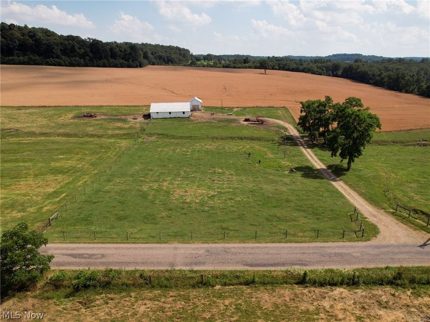 Auction Date August 5th at 6 PM.   The past few years the real estate market has been crazy to say the least but as the saying goes,  “ Good things come to those who wait”.  Located just north of Nashville this 51.917 acre property has been well worth the wait. The land has nice gentle rolling terrain that is mostly open tillable ground or pasture with some woods at the southern part of the property. There is a good flowing creek flowing from east to west along the front half of the property. With Parcels ranging from 4 to 26 acres allowing you to pick and choose on which you desire to build your dream home on. Buildings include a 60’x50’ block flat barn and a 20’x30’ pole building. Feel free to walk the property at your convenience. Real Estate Terms: 10% nonrefundable down payment day of sale with the balance due at closing. No financing or other contingencies, property sells “AS IS”. Sellers to transfer any and all owned mineral rights. Property sells subject to all articles of reco