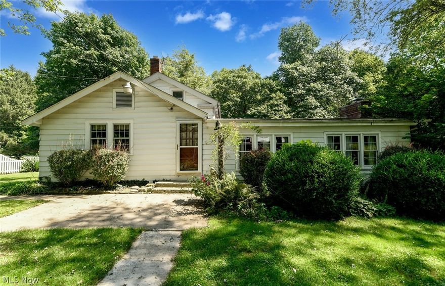 Don't miss this one!  Century home located in the Cuyahoga Valley National Park.  Located on 1.35 acres surrounded by the National Park.  The home features a large family room with vaulted ceilings and fireplace, six bedrooms, and charm and character throughout.  The property has three outbuildings that would be perfect for many different uses.  Close to biking, hiking, and downtown Peninsula.  Call today for your private showing.  You will be glad you did!