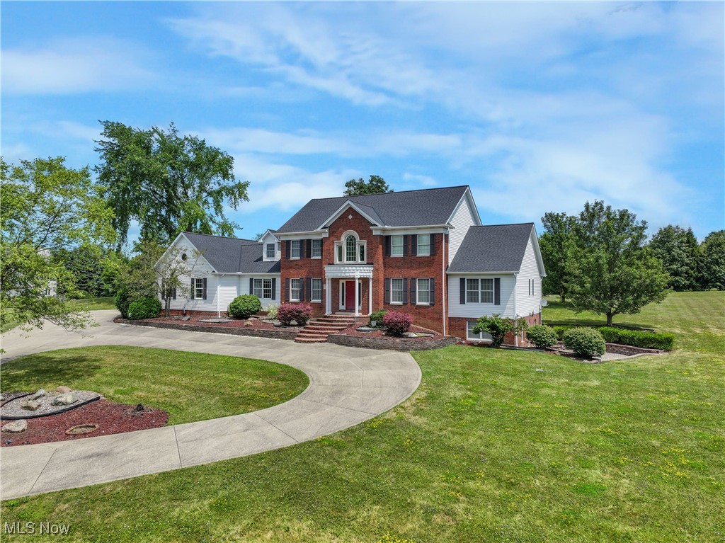 Stunning 5-bed, 5-bath custom-built home offering over 6,000 sq ft of meticulously designed living space. Situated in a peaceful, well-maintained neighborhood, this property offers privacy and serenity while remaining close to essential amenities. Thoughtfully constructed with 2x6 walls and enhanced insulation throughout, the home ensures outstanding energy efficiency and year-round comfort.
The versatile floor plan features high ceilings and four staircases, providing both open gathering areas and private retreats. All five bedrooms are generously sized, ideal for families, guests, or dedicated home offices. Four full bathrooms provide ample convenience. The updated kitchen features granite countertops and elegant cabinetry. Two separate laundry rooms enhance functionality.
A full in-law suite with its own kitchen offers private living quarters for extended family, guests, or multi-generational needs. The expansive basement includes a fitness room, recreation space, and workshop area—perfect for a variety of lifestyle needs.
Outdoors, a massive 30x60 outbuilding adds 2,700 sq ft of additional space. Fully equipped with natural gas, electric, water, an industrial furnace, and a four-post automotive lift, it’s ideal for hobbyists, car enthusiasts, or additional storage. An RV parking pad with full electric hookup is also included. The lot offers ample space for outdoor enjoyment, gardening, and recreation.
A truly rare find combining quality construction, functional design, and outstanding amenities—this home is a must-see!
Additional Updates/Features: with 2 new high-energy furnaces and AC in 2025, a new 75-gallon hot water tank. Two pavered patios.