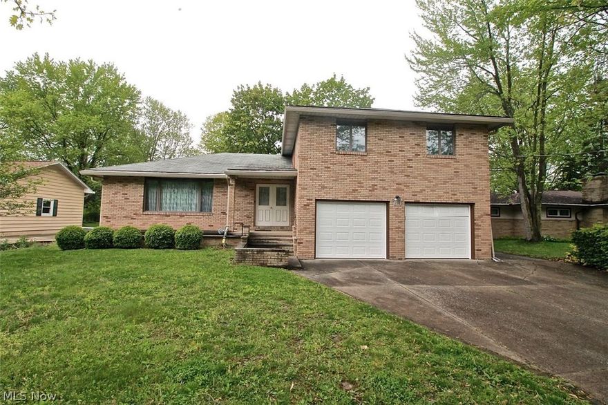 Lovingly and very well cared for BiLevel home on a huge lot with four bedrooms and three and a half baths. Spacious open kitchen with plenty of countertop and storage space for all of your cooking and entertaining needs.  Nice flow throughout the home, dining room right off the kitchen for easy access adjoining the living room.  Nice open front entrance through the big double doors leading you through the living room or down the hall to the kitchen.  A bedroom on the first floor along with a half bath, and a sunroom which leads out to the massive deck out back.  Upstairs you will find three more huge bedrooms and two full baths, one of the bedrooms is the master; each bedroom has walk in closets and two full baths which completes the upstairs. Large basement, partially finished, there is the basement, office and workshop area plus a full bath! There is an extra large hot water tank and a new gas line has just been run.  Don't miss this one,  it won't last long, plus an added asset with