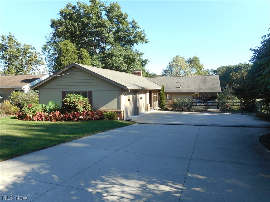 Welcome to this beautiful contemporary home w/distinguished professional interior design. Located in the private community of Twin Lakes, this lake view property features updates galore. The designer eat-in kitchen offers custom soft close cherry cabinets by Ailes Millwork, 2 pantries, a desk area, island, tiled bksplash, SS appliances (Wolf Gas cook top) & hardwood floors. A formal dining room opens to the living room accented by a gas FP & an entire wall of windows w/gorgeous views of East Twin Lake & the backyard. Cumaru Brazilian Teak hardwood floors are featured in the living room, dining room, hallway, master, & other 1st floor bedroom. A renovated master bedroom offers 3 large closets. The main floor full bath has been updated w/a soft close double vanity & linen closet. The powder room has been renovated as well. On the lower level you’ll find bamboo hardwood flooring & a rec room with a gas FP & wall of windows that could easily be turned into sliders to access the out