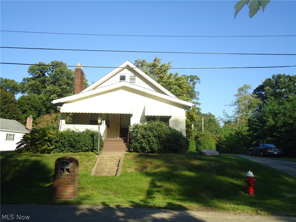 Don't miss this one! Beautiful 3/4 Bedroom home loaded with charm and character. Natural trim & refinished hardwood flooring on 1st floor . Freshly painted thruout. Updated kitchen with breakfast bar opens to dining room and living room. A great place to entertain or have family functions. 2 bedrooms and 2 FULL baths on 1st floor...... 1st floor laundry too! Upstairs is a huge master bedroom with 2 large rooms....could easily be the 4th bedroom. The 9' ceilings add an open feeling throughout the 1st floor living area. Outside, enjoy your park-like setting... quiet area....over 1/2 acre lot...fenced back yard with garden area and shed. 2 car detached garage too! This is like country living in the city....yet just steps to Galt Park and Brookledge golf course. Call today for your private viewing...you'll be glad you did!