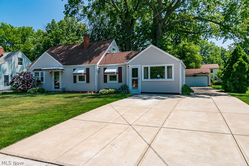 Location! Location! Location! This 3 bedroom home with an office or bonus room has many updates including furnace, hot water tank, windows and new extra wide cement drive. Home features large family room , living room and an updated kitchen. Two bedrooms are on main floor and 3rd bedroom and office are upstairs. For the car buff there is an oversized garage -24' x 36' that is fully insulated and heated. Call today for your private tour.