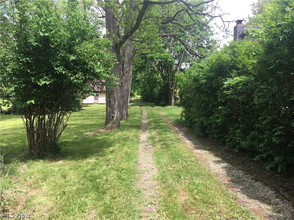 Value is in the land - City sewer and water - .4287 Acre - Very small home on site in rough condition - Great location just West of Five (5) Points, very convenient to all Tallmadge amenities - Residentially Zoned - Front 75 feet - Back 80.32 feet West(left) side 264.35 feet East(right) side 235.61 feet - No delays to close - Sold As Is Where Is Nice Opportunity!