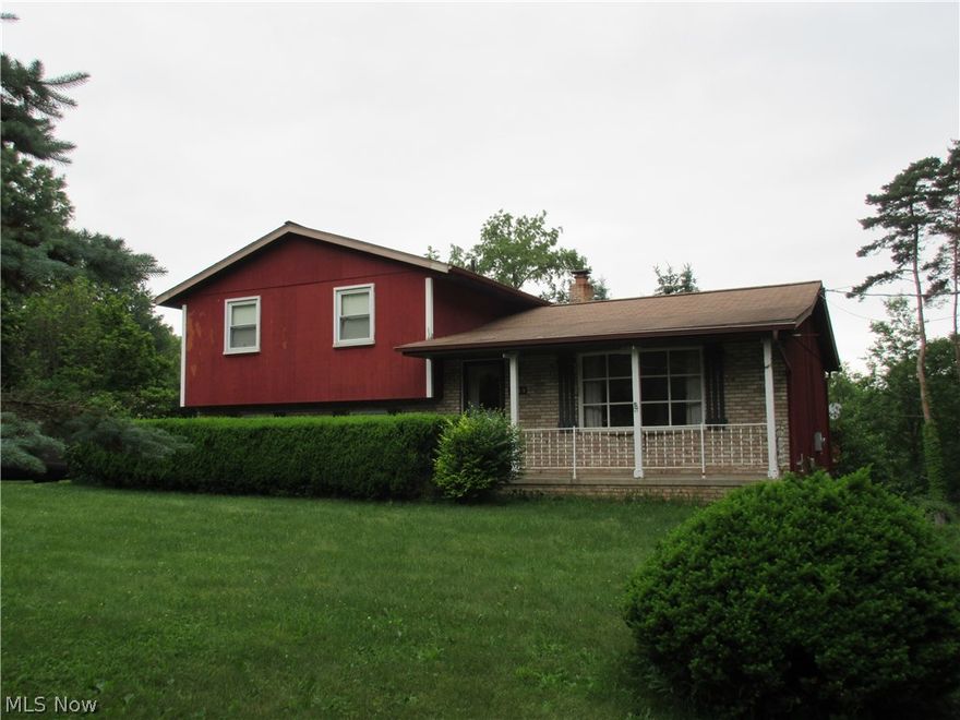 TREMENDOUS VALUE FOR THIS 3 BR 2 BA FOUR LEVEL SPLIT HOME!   Situated on a 1 acre lot and conveniently located, this home offers fantastic possibilities.  Walk out to the 22 x 17 deck overlooking the spacious.   Plenty of room available in the 2 car attached garage and newer 10 x 12 storage barn.  The master bedroom has an adjoining full bath.  The lower level family room has an attractive stone fireplace.  PRICED TO SELL!