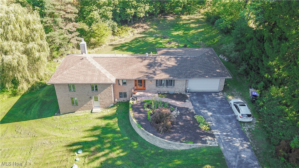 Welcome to this beautifully maintained 4-bedroom, 3-bathroom brick ranch, perfectly situated on two parcels totaling 1.61 serene acres. This home offers the best of both worlds, peaceful country living with the convenience of nearby shopping and national parks just minutes away. Step inside to discover a thoughtfully designed main level featuring a spacious living area with a fireplace, first-floor laundry, and generously sized bedrooms. The bright and airy walk-out basement is fully finished and boasts its own private entrance, complete with a second kitchen, bedroom, bathroom, and large living space with another fireplace, perfect for extended family, guests, or potential rental income. Large windows throughout the basement bring in beautiful natural light, creating a warm and inviting atmosphere. Enjoy outdoor entertaining with two expansive decks, ideal for hosting gatherings or simply relaxing and taking in the view. A professionally constructed retaining wall (2022) adds structure and charm to the landscaped front yard. This home has been meticulously updated to ensure peace of mind, including a new septic system (2021), brand new furnace and A/C (2025), new roof (2025), new hot water tank (2025), and new flooring in the basement bathroom (2025). A home warranty is also included for extra reassurance. Don't miss your chance to own this versatile and move-in-ready home in a great location. Schedule your private showing today!