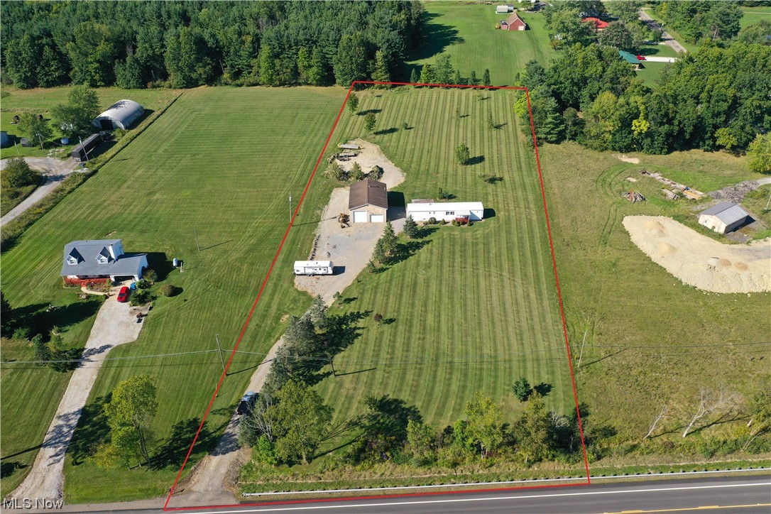 Opportunity is knocking with this beautiful 3+ acre land. With multiple possibilities for property use buyers or investors can’t miss with this one. The modular home on the property boasts 3 beds and 2 baths for comfortable and easy living. The garage also features an apartment above the work area. With great size and space for vehicles or to use the space as you envision. Great and well maintained land is highly sought after so don’t miss your chance to take a tour of the property to see if its the right fit for you!