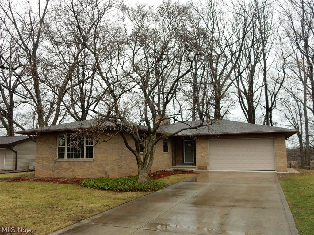 What's not to love about this large renovated 3 bedroom, 2 1/2 bath brick ranch overlooking the wooded hillside of the Brookside Reservation? Huge great room with woodburning fireplace overlooking the wooded back yard, all new kitchen with ceramic floor and subway tile backsplash, eat-in area with corner windows taking in the view, large master suite with great light and attached full bath, ceramic tile foyer with view to the back yard, renovated 2 1/2 baths on first floor with additional toilet and tiled shower on lower level, large family room with woodburning fireplace in walk-out basement, adjacent room with a large retro wet bar, large attached garage with floor drain, hot and cold water, new tear off roof and new A/C. Beautiful Old Brooklyn location with easy access to downtown, I-71, I-480, Brookside Reservation and the Zoo!