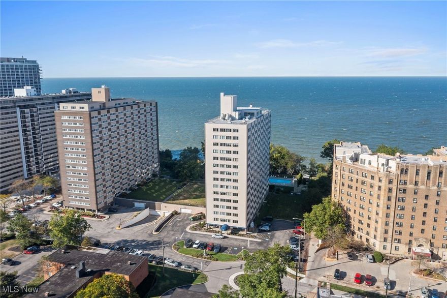 Relax and enjoy breathtaking Lake Erie waterfront and Cleveland’s Downtown skyline views in Unit 606 - a rare opportunity to own a corner unit on the highly desirable lake side of Marine Towers East, situated on Lakewood’s historic Gold Coast. This 2-bedroom, 2-bath condo is filled with natural light from wraparound windows, creating the ultimate lakeside retreat. A sunroom with floor-to-ceiling windows overlooks both the water and the outdoor pool - perfect for morning coffee or vibrant sunsets. The kitchen features recently updated countertops, a new sink, and abundant cabinetry, while the spacious primary suite offers a walk-in closet and private bath. Recent updates also include newer flooring throughout. All appliances are included. Marine Towers East residents enjoy a comprehensive list of amenities and services included in the monthly association fee: heat, A/C, water/sewer, trash, laundry facilities on each floor, heated parking garage with optional assigned spaces, and ample guest parking. The building offers multiple spaces for leisure and connection, including a rooftop deck with panoramic views, outdoor in-ground pool, picnic areas with gas grills, and a party room for larger gatherings. For overnight guests, a rentable suite is available. Pet owners will appreciate the fully fenced dog run, while hobbyists can take advantage of optional storage lockers, bicycle storage, and even a DIY car wash station inside the garage. Secure building entry and a welcoming lobby mail room add peace of mind, while the prime location offers easy access to US-20, Lakewood’s vibrant dining and shopping, Metroparks, and all that Cleveland’s west side has to offer.