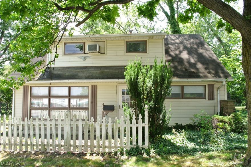 Attention DIY-ers! It doesn't get much better than this! This charming Cape Cod puts you within 1.5 miles of dining, parks, and shopping. Almost completely fenced-in and surrounded by mature trees, you will love spending your summers in the natural shade of your own private getaway. With the 264 sq/ft covered patio and driveway large enough to park 8 cars, you're set for hosting large gatherings of friends and family. When entering the front door you are embraced by the vintage atmosphere of the spacious living room. A gas burning fireplace accentuated by floor-to-ceiling brick is the centerpiece. This former model home's kitchen boasts plenty of cabinet space for all of your cooking and storage needs. Featuring a large primary suite with his and hers closets, and with three additional bedrooms, this mid-century home is a blank canvas for your imagination. Bring your ideas, because with some TLC you could make this home a little slice of paradise. The furnace, hot water tank, and many