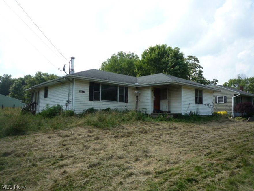 3 BR Ranch located on a nice quiet stretch of road in Freedom Twp!  2 Lots for a total of approx 3.5 Acres!  Huge Barn with stalls.  Fenced Pastures.   Come grab this bargain priced property and build your dream farm!  James A. Garfield School District!  This is a Fannie Mae HomePath Property.