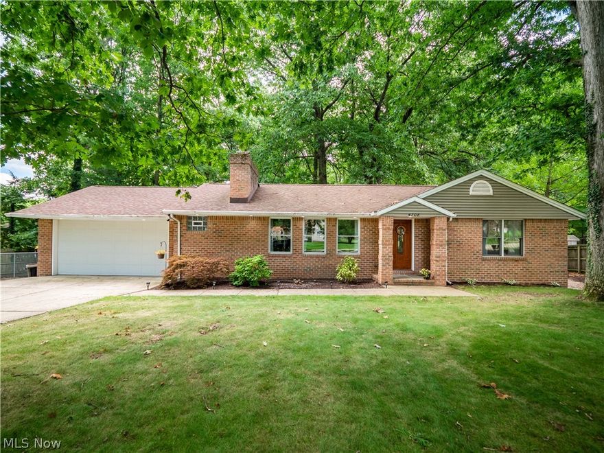 Beautiful brick ranch on quiet street with mature trees, almost an acre lot. Inviting living room with gas fireplace and hardwood floors. Kitchen offers plentiful cabinets, granite counters, coffee bar, stainless steel appliances and skylight.  Cozy sunroom is perfect for relaxing and enjoying the views of backyard. 2 nicely sized bedrooms have hardwood floors.  Full bathroom features jetted tub and gorgeous vanity, half bath is also updated. Lower level family room is huge, perfect for entertaining!  Laundry and mechanicals on lower level.  Tankless hot water heater, furnace 2020, fresh paint. Excellent schools, close to highways, shopping and downtown. Schedule your showing today!