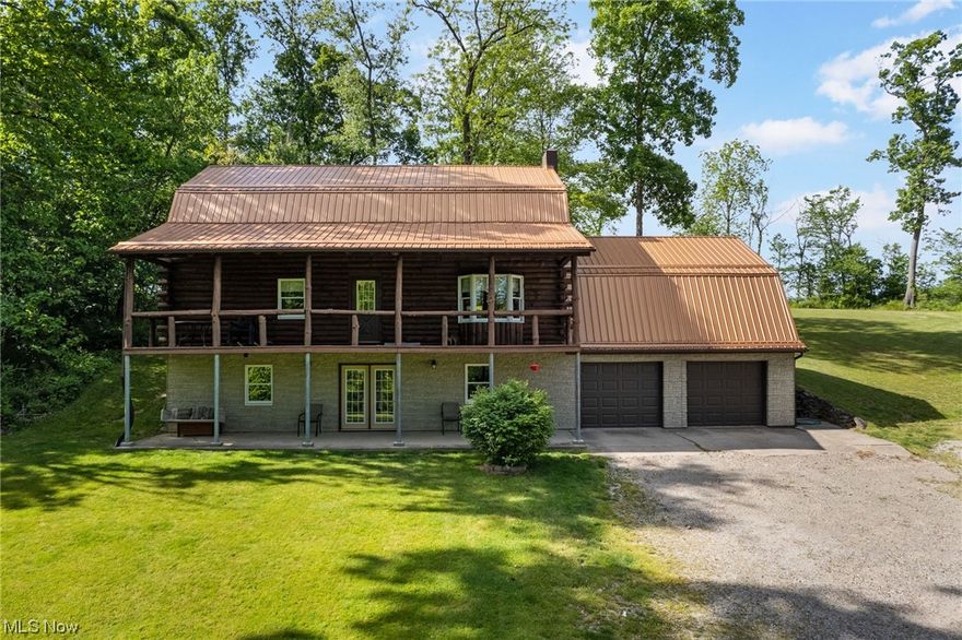 Enjoy the peace and tranquility in the country in this Lovely Log Home on 7.1 acres! First time on the market, this 4 bedroom, 3 bath, charming, rustic Pariso log home was custom built by the current owners with Pine log exterior and red oak interior walls from timber from the land on the first level with some pine walls and floors on the second level. Updates include geothermal heat pump, A/C and ductwork in 2012, first level flooring 2018, and newer metal roof and kitchen appliances. Attached 2 car with extra storage garage PLUS a  29 x 33 detached, insulated detached garage with electric and heat. Owner uses verizon hot spot for work from home internet and has direct TV. Carroll electric Co-Op average bill for 12 months for all of this is only $285 per month! Owners are retaining mineral rights and will transfer surface rights. Just a few minutes from Atwood Lake! If you want an escape to the country, this is it!  Enjoy peaceful walks and rides through your own piece of paradise!
