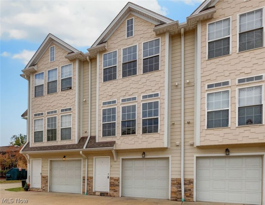 Welcome home to Market Square! This 2 bedroom 1.5 bath townhome has great style and design. The first floor boasts a car attached garage and laundry room. Level two features a living room with new vinyl wood flooring and a wall of windows, kitchen with refrigerator, stove, and microwave, and a half bath. Retreat upstairs to the two bedrooms and a full bathroom.   A great place to call home!