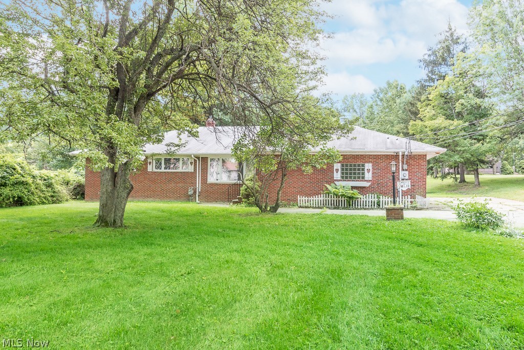 Welcome home to this solid brick 3 bedroom 2 full bath North Royalton Ranch. The 10+ serene wooded acres have so many possibilities. The acreage is currently divided into 3 parcels. Parcel 1 has 100ft of frontage on Akins (1.93 acres)and has the brick ranch with the attached garage on it. Parcel 2 also has 100ft of frontage on Akins (1.93 acres)and has a 40x32 Garage on it complete with a second floor. The garage sits further back on the property so if you decided to build your dream home here the garage would not need to be moved. The 3rd parcel is 6.46 beautifully wooded acres located behind parcel 1& 2. You could build your dream home on parcel 2 and rent the Ranch next door or move right in and enjoy all 10 acres yourself. Updates to the home include a high efficiency furnace, replacement casement windows, cedar closets, a large eat-in kitchen with wood burning fireplace and a finished walkout basement perfect for entertaining. Don’t let this unique opportunity pass you by.