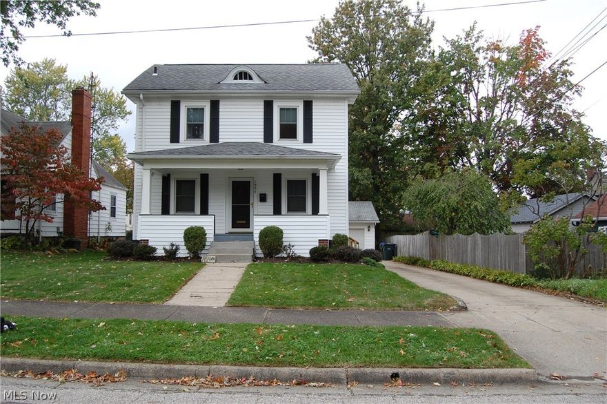 Charming 3BR/1.5BA Colonial in Cuyahoga Falls.  Move in ready!  Enter through inviting front porch into newly carpeted living room with brick fireplace surrounded by built-in shelves.  Spacious formal dining room with bay window and brand new wood floors.  Bright kitchen includes new appliances, white cupboards and Corian counter tops.  Sliding doors off kitchen lead to newly built back deck and fenced in backyard.  Three bedrooms, attic access for extra storage and full bathroom complete the second floor.  There is side door access and two-car garage.  Updated furnace and hot water heater, as well as newer vinyl siding and windows, replaced in 2007.  Home Warranty offered with Sale and Sanitary Sewer Inspection was already completed and has passed.