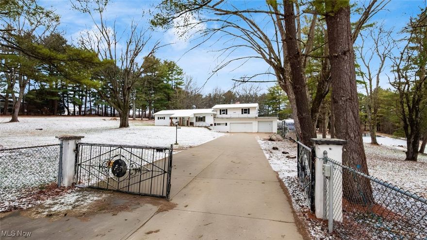 Ready to create your own mini farm? Here is your chance! Nestled on a sprawling 4.23-acre lot, this charming property offers privacy and tranquility, complete with a fully fenced-in perimeter and a gated driveway. Whether you're seeking a peaceful sanctuary or space for hobbies, this home has it all. Inside, you'll find 3 spacious bedrooms and 1.5 bathrooms, providing comfort for the whole family. The inviting living spaces are perfect for relaxing or entertaining, with a cozy wood burning fireplace in the spacious living room. There have been several recent updates including new kitchen appliances, new bottom kitchen cabinets, tile backsplash, and countertops as well as new flooring in the kitchen, dining room, laundry room, and hallways. With two furnaces and air conditioning units, this home ensures year-round comfort, no matter the season. The property also features a 3-car-attached garage with an extra bedroom off of the garage, offering ample space for vehicles and storage, as well as a separate heated 1-car detached garage/shop, ideal for a workshop or additional storage needs. Outside, enjoy your very own pond, creating a serene backdrop for outdoor activities or quiet moments of reflection. This unique home combines the best of country living with convenient access to all the amenities you need. Don’t miss the opportunity to own this stunning, private oasis. Schedule your showing today!