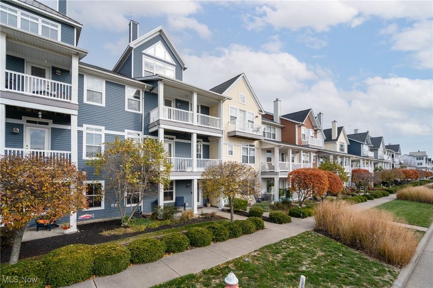 A home like this doesn’t come along often. It’s the kind of place where morning coffee comes with river breeze, and evenings carry the soundtrack of live music and waterfront life. This three-bedroom residence stands over the Black River, with boat docks at your feet and Lake Erie in view. From the balconies, you can watch Rockin’ on the River, enjoy fireworks without fighting traffic, or hop the water taxi to join the fun across the river. It’s a lifestyle rooted in community, water, and walkable convenience; there’s nothing else nearby quite like this setting. Inside, the layout is purposeful. Three full stories plus a fourth-level loft, reached by a spiral staircase, create room to live, work, and unwind. That loft makes a natural reading nook, hobby space, or retreat. The ground-floor office is smartly separated from the main living areas, ideal if you work from home or simply want privacy for focused tasks. An attached garage adds daily practicality. The second level is the heart of the home. A true great room, balanced by balconies on both sides, hardwood floors underfoot, and light from every angle. It’s ready for everyday living, easy entertaining, and flexible furniture arrangements so you can tailor the feel to your lifestyle. The bedroom level continues the hardwoods, adding durability and timeless character. Beyond your front door, the amenities seal the value. Residents have access to a fitness center and pool, and a restaurant and event center are just steps away. Walkability here is excellent, whether you’re headed to dining, entertainment, trails, or simply taking in the waterfront. In short, this isn’t just a townhouse; it’s a vantage point on riverfront life, offering space, comfort, and a connection to one of the area’s most distinctive neighborhoods. If you’re ready for a home that feels like a front-row seat to the best of waterfront living, this one delivers.