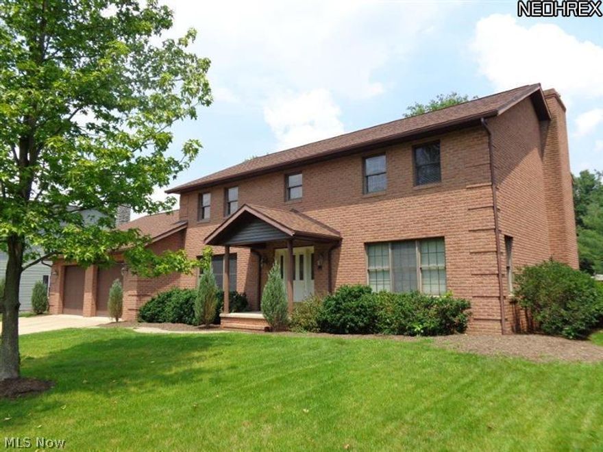 Outstanding all brick Colonial style 2 story home. Has just been freshened with new interior paint done in newest shades. Lovely yard and large exterior custom deck. This home features 4 Bedrooms with an additional Bedroom in the full finished Basement. 3 full bathrooms, 2 jetted bathtubs and 1 half Bath. Tile flooring in Kitchen (appliances stay) and in 1st Floor Laundry room. Gas fireplace in 1st Floor Family room. Huge Recreation Room with wet bar and wood burning fireplace. New furnace and air in 2012. Attached 2 car garage. Close to park, pool and not far from new I77 interchange.