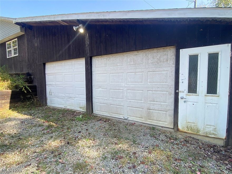 Manufactured ranch-style home on almost 9 acres. 4 bedrooms, 2 full baths. This home offers multiple additions including a large master bedroom that includes a private bathroom with a free-standing claw foot tub. Additions also include a nice private front family room with lots of natural sunlight that leads into the main living room area. Remodeled main bath with walk-in shower. The kitchen has a modern-style tin backsplash, deep farm-style sink, oak cabinetry, and an oversized pantry area. All appliances stay! The dining room leads out to a large double-tier back deck. The home has an attached 2-car garage with multiple extra storage areas, multiple outbuildings, and much more! Come take a look!  Please note that this is a cash-only sale and any and all Gas/Mineral/Oil Rights Transfer.