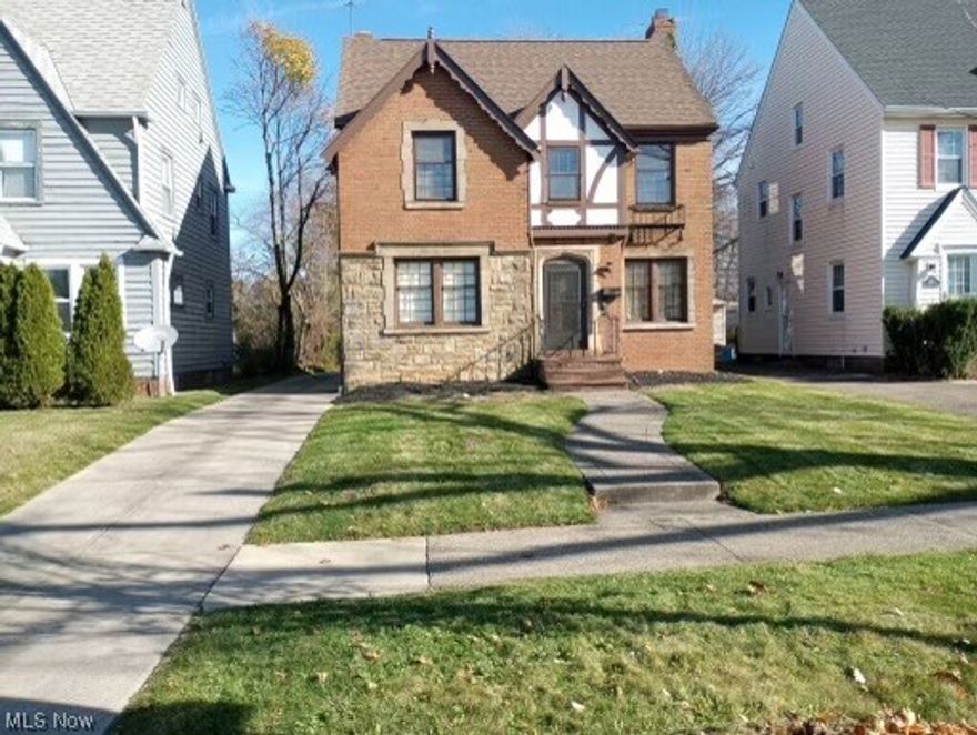 Wonderful brick Tudor located in university hts. Home boasts 4 bedrooms and 1.5 baths. Spacious living room with fire place and original molding. Full dining room with leaded glass cabinets. Eat-in kitchen which has been updated. Enclosed porch off of the living room.  Finished basement with utility room. You will find the fourth bedroom on the third floor which is perfect for a teen suite or guest room. 

Home Improvements include: NEW GARAGE (2021)NEW ROOF (2021)EXTERIOR PAINTING AND CARPENTRY (2022)NEW REAR SECURITY DOOR (2022) NEW FRONT STORM DOOR (2022)NEW KITCHEN (2023) REFURBISHED SECOND FLOOR BATHROOM (2023)REFURBISHED BASEMENT RECREATION ROOM (2023)NEW FLOORING (KITCHEN, SECOND FLOOR HALLWAY, BASEMENT STEPS) 2023

As-is sale, buyer to assume POS. This home will not last long. Schedule your showing today.