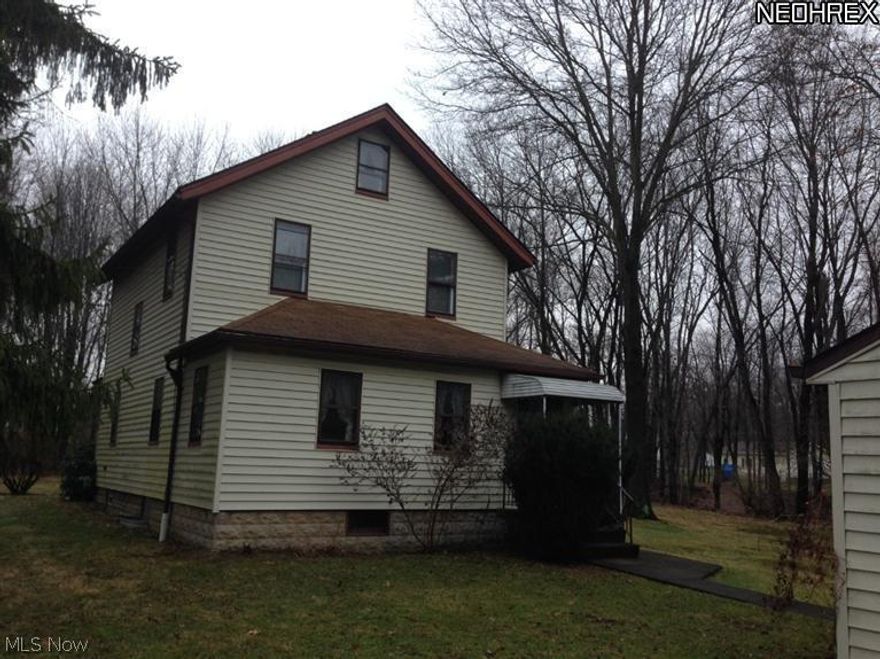 Awesome find! This is a great well maintained home Off the beaten path! Nice sized living room , open kitchen with great cabinet and counter space plus the Stove and Fridge stay! Cute parlor. Nice enclosed porch/sunroom/mudroom great for multi uses! The upstairs has three nice sized bedrooms and large full bath with tub shower combo. Full basement. Newer updates include the furnace, water tank and electrical box and some vinyl windows, vinyl siding and in the basement there is also a sump pump. Washer dryer stay as well! This home sits on 6 25x100 lots. There's a great 2 car garage! Call for more details, the price is right! Weathersfield Township, McDonald Schools!