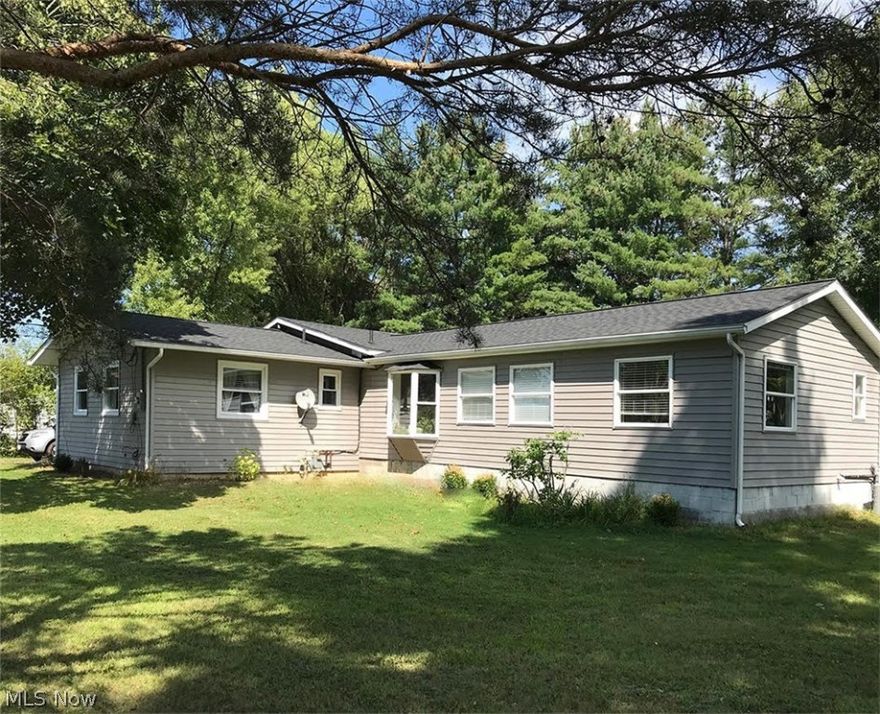 Wonderfully Updated Ranch Next To The Park And The Lake! 4 beds, 2 full baths. Marvel at the completely renovated, open concept Kitchen and Dining room, with beamed, vaulted ceiling, extra large island with plenty of storage and seating, beautiful new windows and stainless steel appliances. Everything was replaced with nothing but the highest quality, from the gorgeous hickory floors to the custom built, white oak, soft close cabinetry! You really need to experience it to truly appreciate all of the thought and care that was put into to this kitchen design! A trendy barn door separates the Laundry Room from the Kitchen. New roof was installed this summer. A brand new 24 x 32 ft pole barn style garage with additional porch was built to replace the old garage. There is a double-sided fireplace in that can be enjoyed either from the living room or outside on the deck. Enjoy making s'mores at the fire pit on the private, .5+ acre lot that connects to one of the many community parks that le