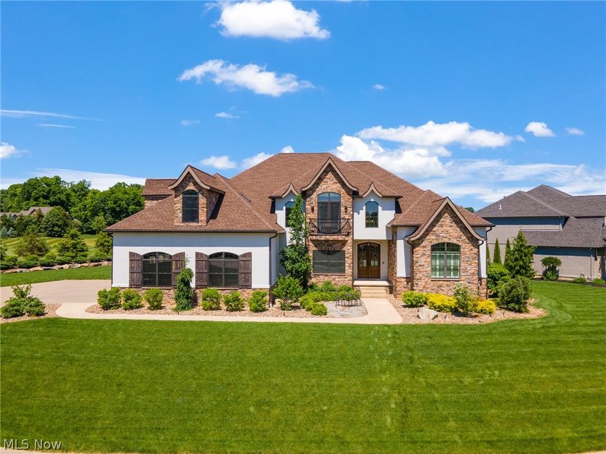 Breathtaking French country home in Winstead Crossing gated community on the 17th hole of Kensington Golf Course. One owner - DeLucia built. Open concept eat in kitchen boasts beamed ceiling, custom white cabinets, quartz counters, double freezer/fridge, farmhouse sink, massive island with seating, walk in pantry and sliding doors to the pool area. Wall of windows floods natural light into the great room with floor to ceiling fireplace, coffered ceilings, builtins, and bar. 1st floor master suite boasts large walk in closet, gas fireplace, private access to patio with firepit/pool, and master bath with double vanity, clawfoot tub with beam, walk in marble shower, and marble backsplash. First floor also features laundry/mudroom with built in lockers, and brick floors, and ½ bath with double troth sink. Upstairs loft area features pool table and bar and opens to the sunroom with sliding door access to upper deck with firepit overlooking pool with outdoor spiral staircase to lower level. 3 spacious bedrooms, 1 with attached bath, and 1 additional full bath complete the upstairs. Finished walkout basement with family room, bedroom, full bath, theater room, and gym. Outdoor oasis features pool/hot tub, full kitchen, waterfall, separate half bath/pool house, storage under upper deck, and amazing landscaping. Additional features/upgrades: Pella windows, Vector security, irrigation system, 3 car garage, imported porcelain tile throughout, wired/wireless media throughout indoor/outdoor, whole house generator, Culligan water softener, Reverse osmosis, driveway sealed annually. One year home warranty for your worry free purchase!