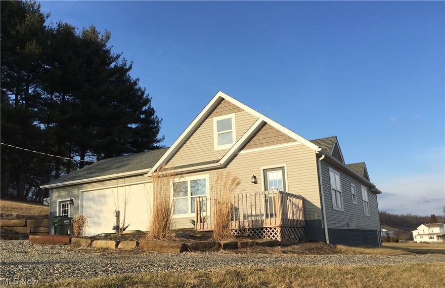 Shows just like a brand new home! This tastefully remodeled home has 4 bedrooms, 2 full baths, 1st floor laundry and an over-sized attached 2 car garage. It is a beautiful setting on 2.46 acres that has a good mixture of open space and woods. The kitchen is brand new and includes all of the appliances. There are 2 bedrooms and a full bath on the first floor and 2 bedrooms and a full bath upstairs. The walk out basement has lots of storage. There is a circular driveway with lots of parking.  This is a great county setting just minutes from town. Immediate possession!