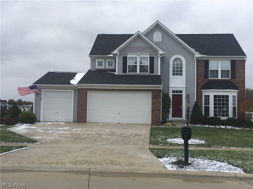 Gorgeous 4 BR, 2.5 BA, 3 car garage Colonial in up and coming North Ridgeville, just a 5 min. walk to the Sandy Ridge Reservation Metropark.  Impress your guests w/the grand 2 story foyer and solid cherry floors.  Relax by the Great Room stone fireplace, or enjoy coffee in the Morning Room w/vaulted ceiling and window filled walls for optimal viewing of your premium pond lot. You will love cooking in your well appointed kitchen w/9x3 ft gourmet island & 42 in solid cherry cabinets.  Make the most of family holidays in the stunning formal Dining Room, complete w/tray ceiling & bay window.  Entertain on your huge paver patio w/lighted columns & spectacular pond views.  An office w/French doors, a powder room & a laundry room complete the main floor. On the upper floor, retreat to your large Owners Suite w/beautiful Master Bath, cathedral ceiling, separate sitting area & over-sized walk in closet.  Three additional generously sized bedrooms & a full guest bath are also located on this floor. The lower level boasts a very large, beautifully finished area, perfect for a family room, home theater or game room.  A 24x7.5 ft bonus room can be used for storage, or finished to create a play room or craft room.  The 3rd room is plumbed for an additional full bath. High end window treatments throughout & upgraded fixtures make this home move-in ready.  All major appliances stay incl. stainless steel range, oven, refrigerator, dishwasher, microwave, garbage disposal, washer & dryer.