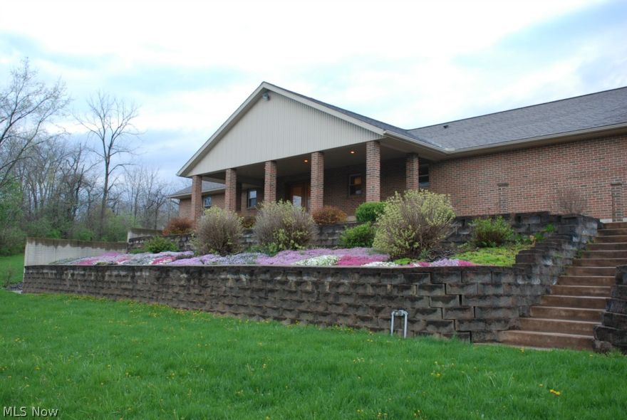 Country living at its best with over 12 acres with this gorgeous Brick home with a barn that has water and electric , pond, fencing, woods, pasture and creek..  Beautiful custom built open concept  brick home 3 bdrm. has 3 baths with  walk out lower level finished with full kitchen  and 3rd bath. Lower area has bedroom or office too.  Home has 2 car garage and addition 3 car detached garage. 1st floor laundry. Perfect home for 2 families or in law suite. Home is surrounded by beautiful acreage. Perfect for livestock, horses, cattle or farming or just relaxing on the back covered porch.