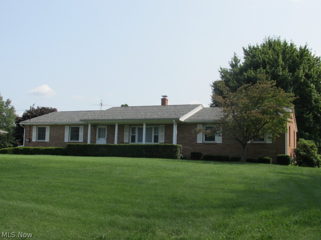 Well-maintained all-brick original Henry Yoder home has good natural light and extra storage * Conveniently located on very nice half acre lot * This lovely home offers 4 bedrooms and 2.5 baths all on main level * Gracious size rooms throughout this great floor plan * Beautiful hardwood floors * The 4th bedroom and 1/2 bath area on separate side of home for more privacy * Brand new stainless steel refrigerator, stove, and built-in microwave * Updated light fixtures * Solid six-panel interior doors * Relaxing sunroom off dining room slider opens to large, level backyard for enjoyable activities * Tall, full useable basement ready to finish your way * Extra wide and long full concrete driveway * Two-car attached garage with updated insulated door has cold water and drain * Newer one-layer roof * Small barn keeps garage roomy * You'll appreciate the condition of this nice home *