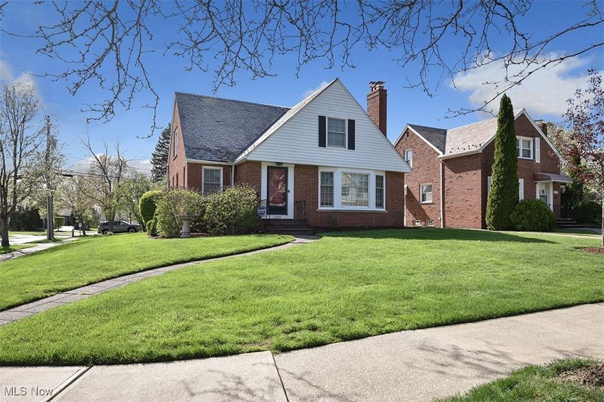 Welcome home to this delightful 4-bedroom, 2.5-bathroom Cape Cod with numerous updates! Gleaming hardwood floors, high ceilings, built ins and updated wood windows add warmth and character throughout.  The spacious living room with a bay window is full of an abundance of natural light and features classic crown molding and a cozy fireplace. The kitchen is a chef's dream, boasting handsome cabinetry, tons of counter space, ceramic tile, large pantry, and stainless-steel appliances. The kitchen opens to the formal dining room providing an open floor plan perfect for entertaining. On the main floor, you’ll find an ample bedroom and a full bath, offering flexibility and ease of living. The first floor 4-piece bathroom has been gorgeously updated with sparkling quartz counter tops, walk in shower, deep tub and tons of storage. A newly enclosed porch rounds out the first floor and is a perfect spot for morning coffee.  Upstairs, you will find a generously sized primary bedroom with a huge closet. Two additional bedrooms, a 3-piece full bathroom and a large cedar closet complete the second floor. The full basement has tons of potential and features glass block windows, laundry, a half bathroom, retro rounded bar, fireplace and ample storage.  Step outside to enjoy the lovely landscaping,2 car garage and fenced in backyard. All this in a quiet walkable neighborhood just minutes from fantastic dining, shopping, Community Center, schools, the Cleveland Clinic, CWRU, and University Circle. Schedule your private showing today!