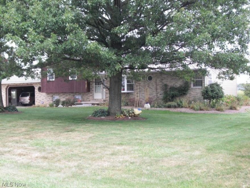 Country Split Level (4 Levels) on Level, Well Landscaped 1 Acre Lot With 198 Feet Of Frontage. Concrete Driveway To House And A Gravel Driveway To A 40x30 Garage With New Lighting And Windows, OverHead Storage...Heating Is Supported By An Outside Hardy Woodburning Furnace Which Also Heats Hot Water...A Propane Backup Boiler Is Also In Place...Basement Lower Areas Are Protected By 2 Sump Pump Crocks...A Water Softener Is Included...Master Bedroom Full  Bath Has A Jetted Tub And A Stand-in Shower With 2 Sinks, Vanity...3 Other Bedrooms And 2 Full Baths Are Located In Upper Level Of Split Above...Plenty Of Room, Bathrooms and Bedrooms...2nd Level Down family Room Has Fireplace w/ Wood Stove Insert...If Anyone Would Like, Bookcase At East End Has Area For Large Screen TV...Absolutely A Great Home...Sale Of This Property Contingent Upon Seller Being Able To Find A Property Satisfactory To Them To Purchase.  Norwayne/Smithville S.D.