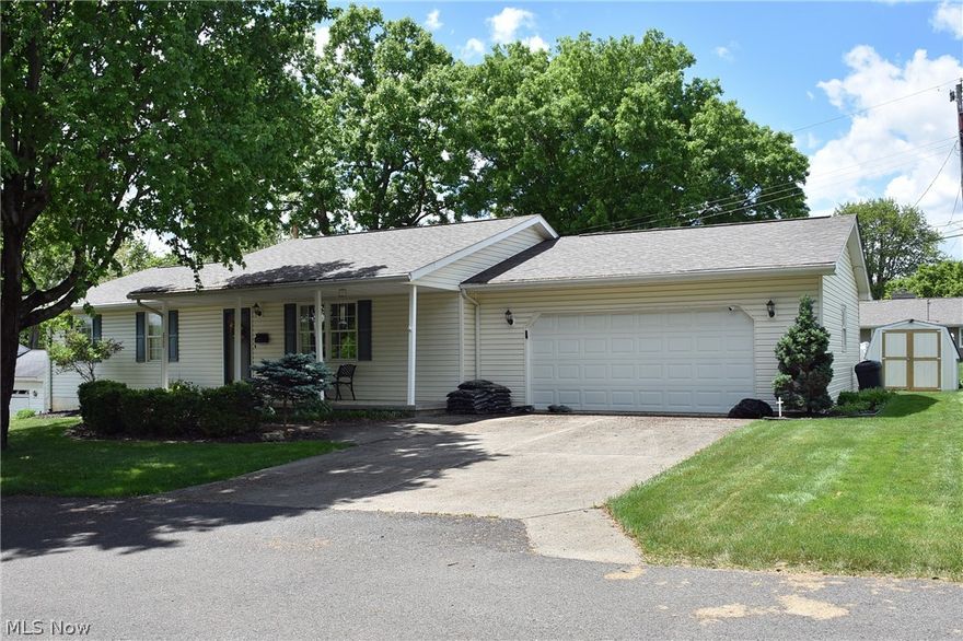 This well maintained ranch home offers 1,344 square feet of living with 3 bedrooms, 2 full baths, spacious living room and kitchen area.  New wood grain floors in living room, kitchen, dining area, and hallway to bedrooms.  Home is in move-in condition.  Beautifully coordinated color scheme and professionally decorated.  Kitchen recently updated with all new stainless upper end appliances and offers a walk-in pantry.  Bedrooms closets well organized.  2 car attached garage with builtin workbench and storage shelves.  Storage building in rear yard.  White privacy fence in rear provides secluded area and wood deck off dining area.  Beautifully landscaped lot and concrete driveway.  A covered front porch welcomes you as you enter this exceptional home in north Zanesville.  Shingle roof new October 2022.