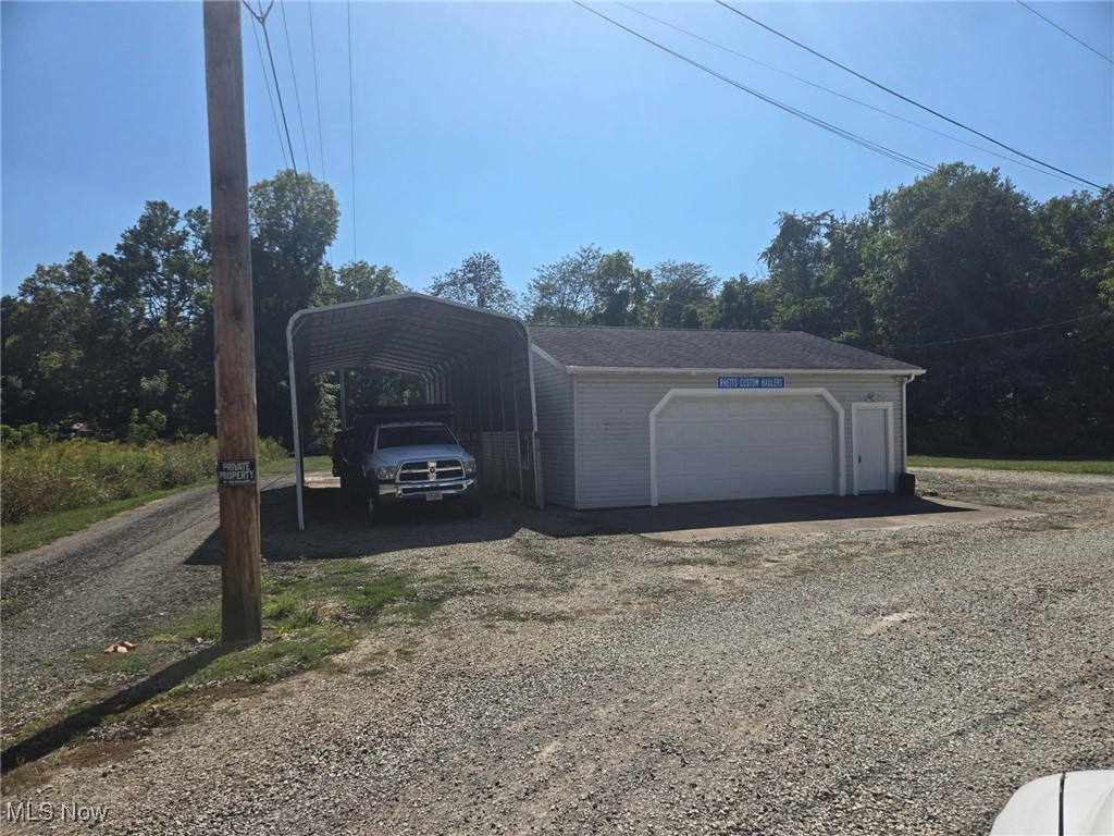 Currently a garage with office space but could be converted to residential because it is insulated with heat and air conditioning, also has a full bath, 3 carport, hook-ups for 2 RV's, 12x26 storage building and a large yard. Take a look and you decide, there are many possibilities here.