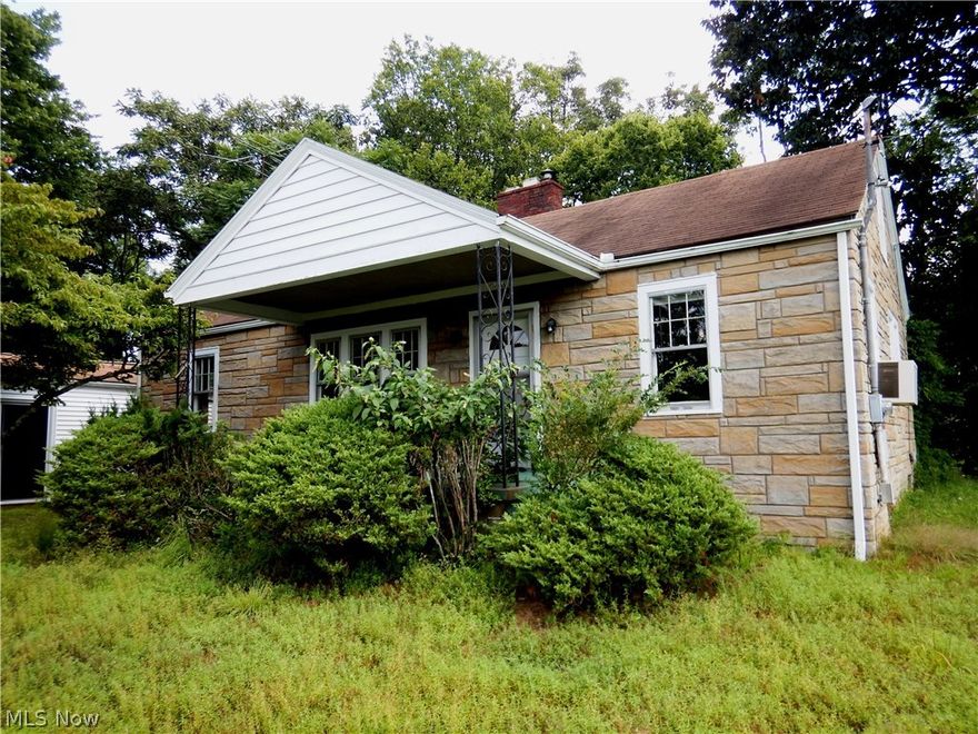 Rare opportunity to own a unique property!  This property comes with TWO independent houses built on the same lot.  House 1 is approximately 1,008 sq ft with 2 bedrooms and 1.5 bathrooms.  House 2 is approximately 1,154 sq ft with it's own living room, dining room, bedroom, full bathroom, and kitchen, plus a walk-out basement.  There is also a 1 car detached garage plus a carport attached to House 1.  Both houses plus garage feature a beautiful faux stone exterior.  House 1: Step back in time to this bright, open, and well laid out World War 2 era home.  Bedrooms are generously sized and separated by the shared bathroom. Kitchen has LOTS of storage space and hookups for an electric stove.  Full basement could be finished off for additional living space or storage.  There is a "Half Bathroom" in the basement, which could be walled off for privacy.  House 2:  Separate living space for a Tenant or friend / family member!  This house features a LARGE living room, dining room, kitchen, bedr